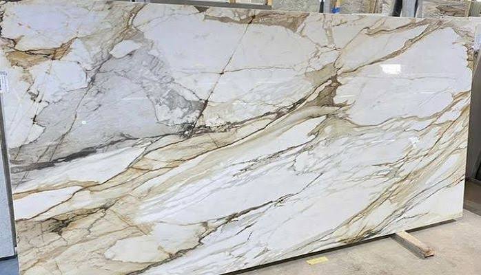Calacatta Gold marble slab with grey and warm gold veining