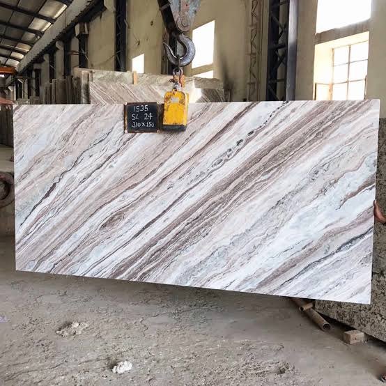 Fantasy Brown natural stone slabs showing flowing grey and brown bands