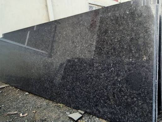 Rajasthan Black granite slab with a dark charcoal mineral texture